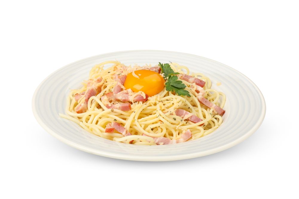 Plate with tasty pasta isolated on plain background