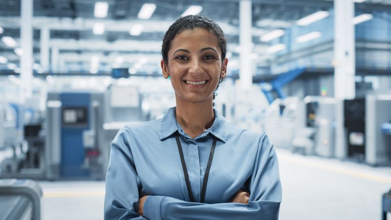 Portrait of smiling female scientist in lab