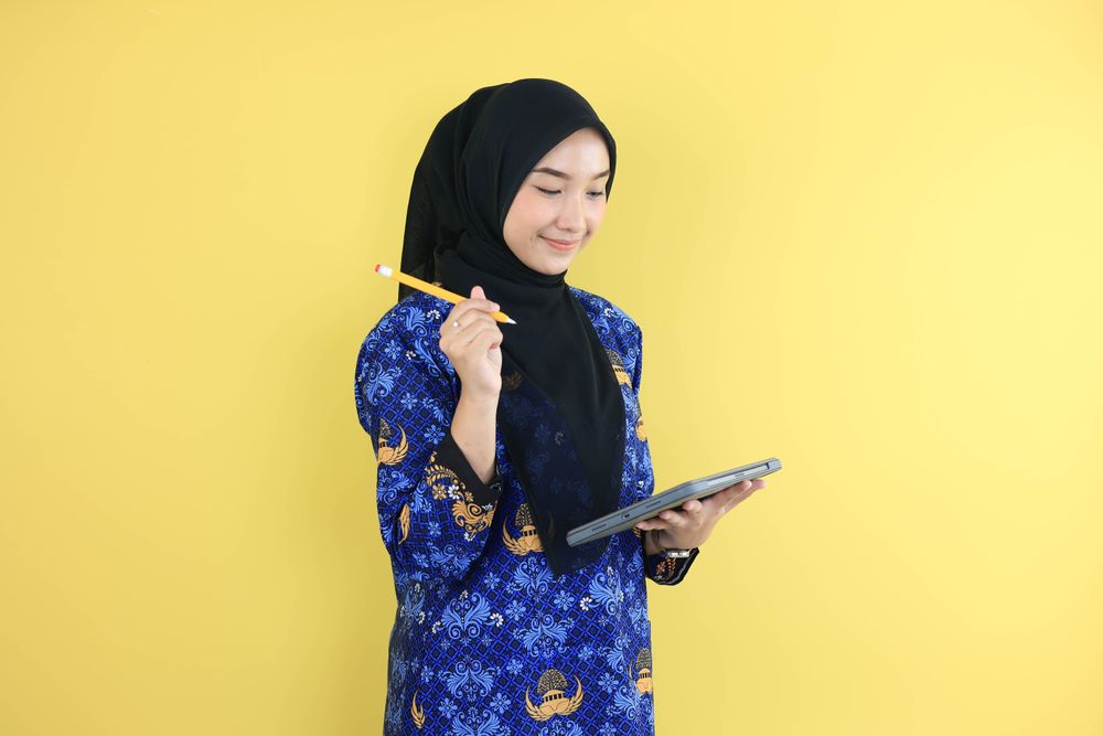 Young FemaleWorker Wearing Korpri Batik Uniform