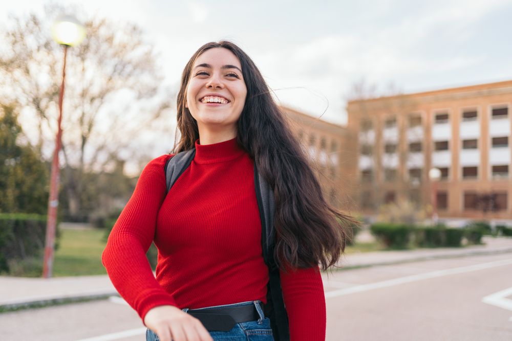 Students portrait leaving class and smiling