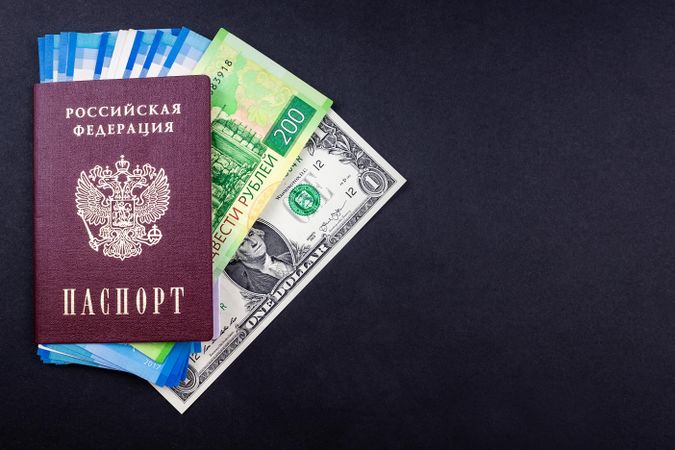 Dollar bill and Russian Ruble in Russian Federation passport