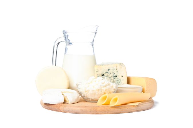 Different types of cheese and milk isolated on blank background