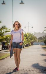 Young girl with a skateboard outdoor