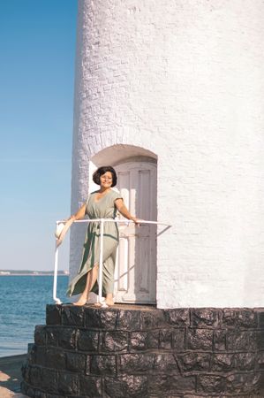 Woman in lighthouse in blurred background