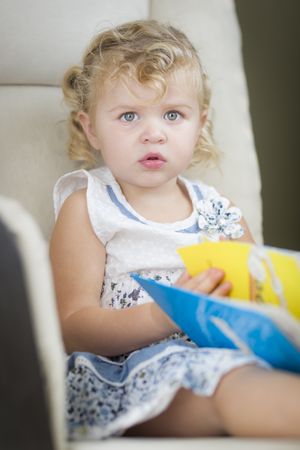 Sweet Little Girl Reading Her Book