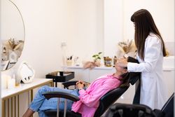 Beautician doing a face care treatment