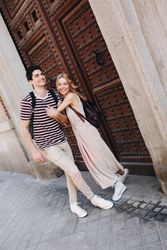 Happy couple having fun while walking in town