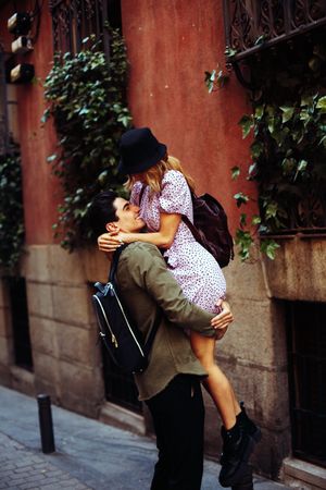 Happy couple having fun while walking in town