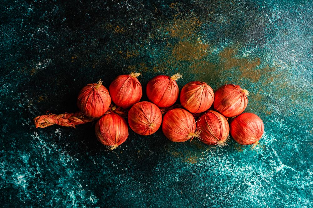 Teal table with braid of onions