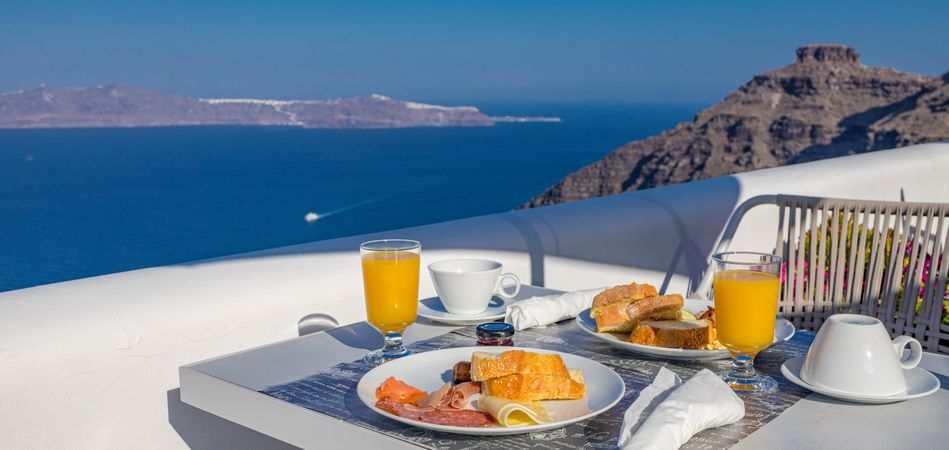 Morning fresh juice and breakfast with blue sea view