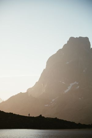 Majestic mountain landscape with human silhouette