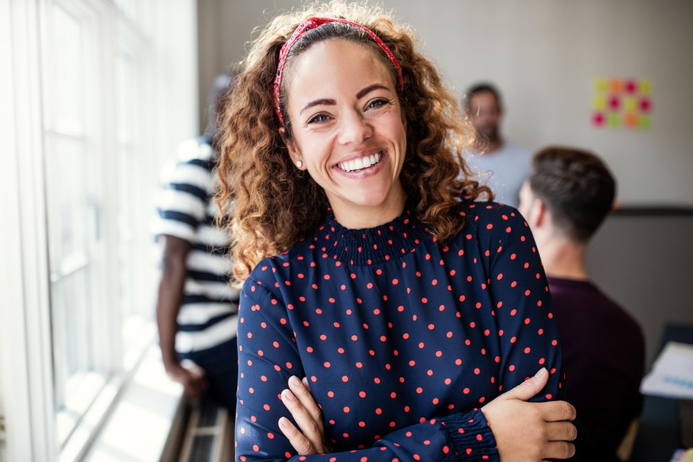 Woman smiling with arms crossed