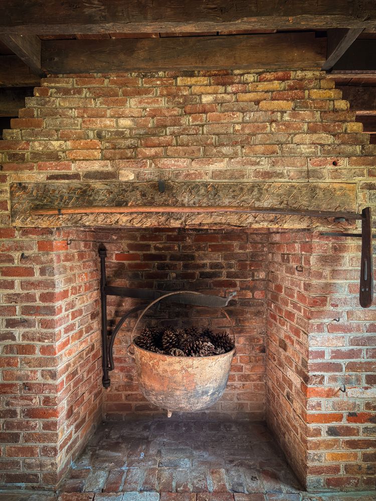 Cast iron cauldron in fireplace