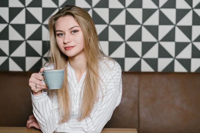 Young woman sitting at cafe