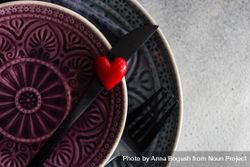 Close up of patterned plates with heart decoration 42662K