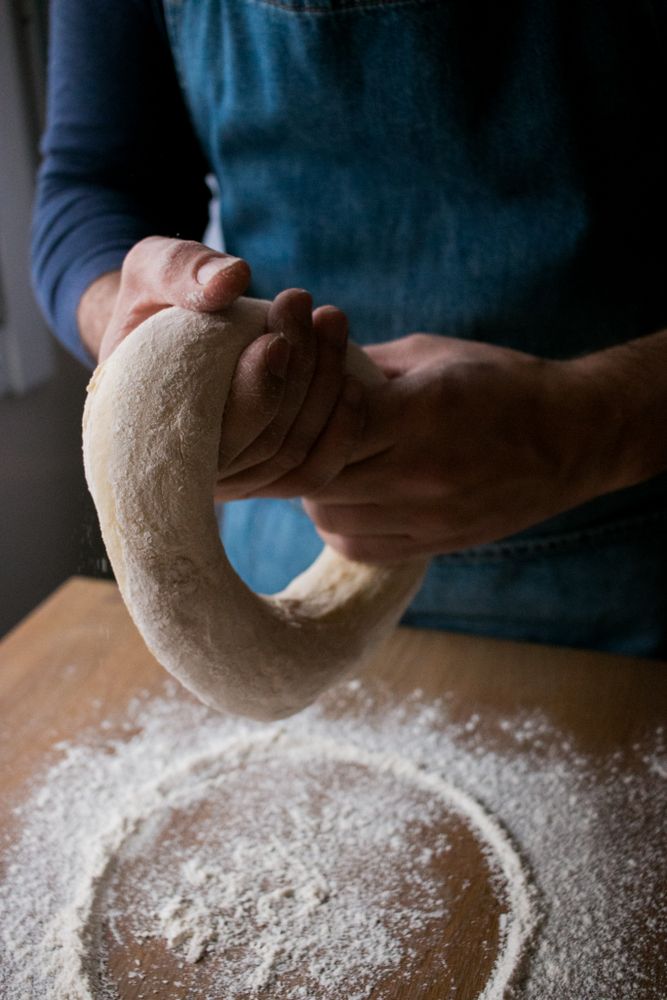 Crop man preparing Rosca de Reyes