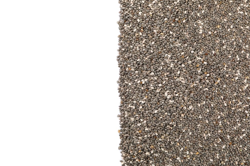 Chia seeds isolated on studio background, top view