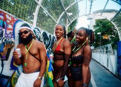 London, England, United Kingdom - August 27, 2022: Group of Notting Hill Carnival revelers on bridge