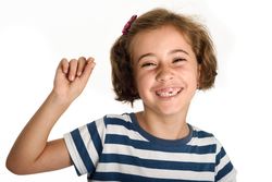 Happy little girl showing her first lost tooth