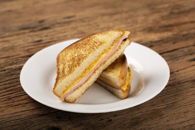 Grilled ham and cheese. Sandwich with cheese and ham on grill.