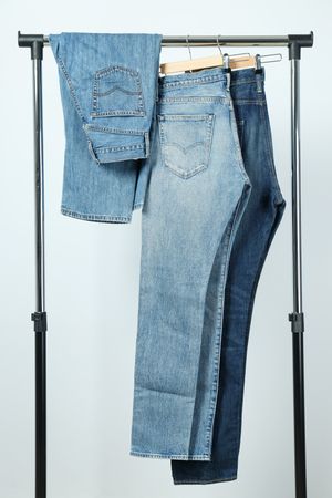Jeans hang on hangers