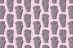 Gray gloves on purple background