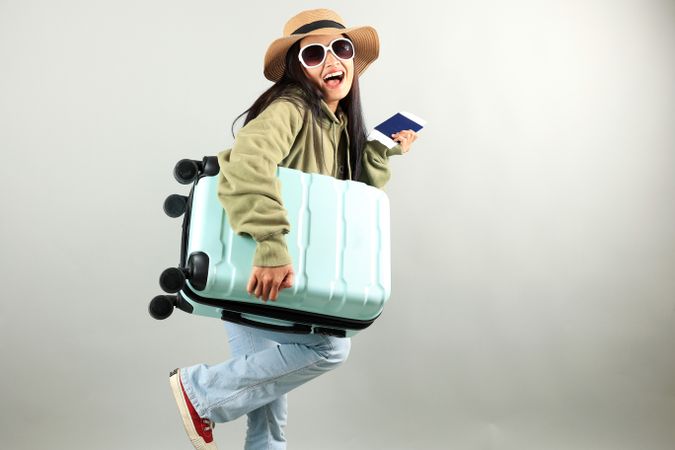 Young Traveler Asian Woman with Luggage, Ticket, and Passport
