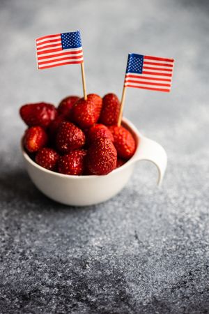 Bowl of strawberries with little USA flags