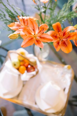 Bouquet and tray on table in hotel room