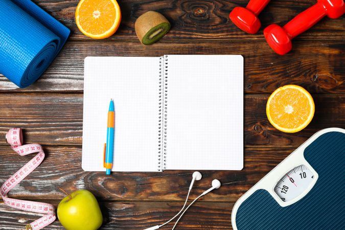 Flat lay composition with healthy lifestyle accessories on wooden background