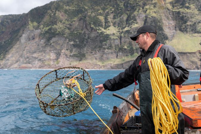 Fisherman collecting lobster fishing nets