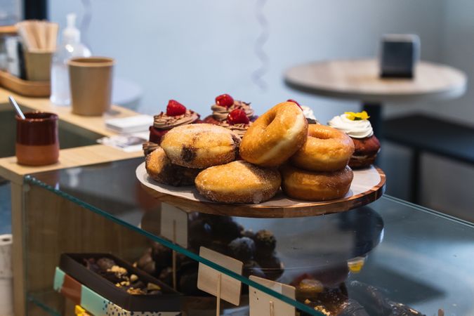 Assorted tasty desserts on tray in bakery