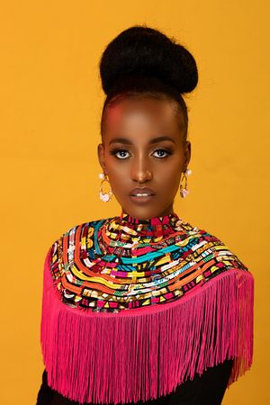 Portraits of African lady against yellow background