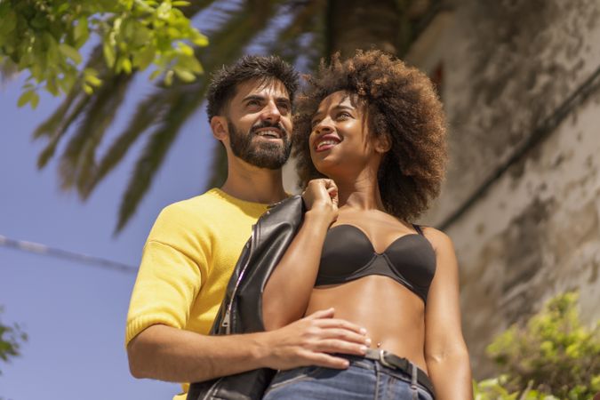 Happy couple flirting on street