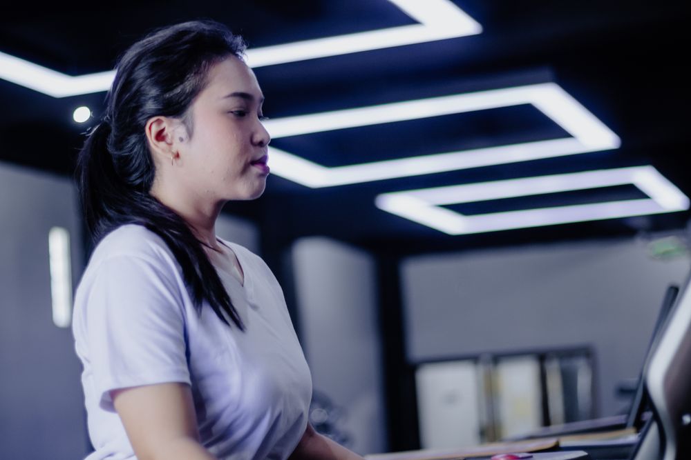 Focused Athlete on Treadmill at Fitness Center for Health and Wellness