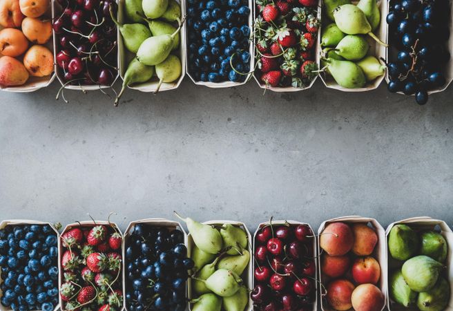 Rows fresh fruit arranged together in eco-friendly boxed, copy space