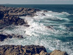 Rough coastline washed by stormy ocean