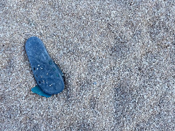 A washed up plastic beach sandle