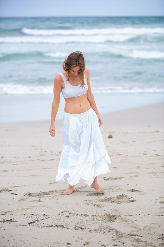 woman dancing near sea
