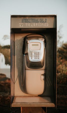 Shabby payphone in countryside