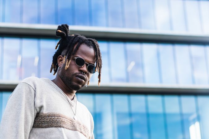 Cool Black guy with dreadlocks in city center