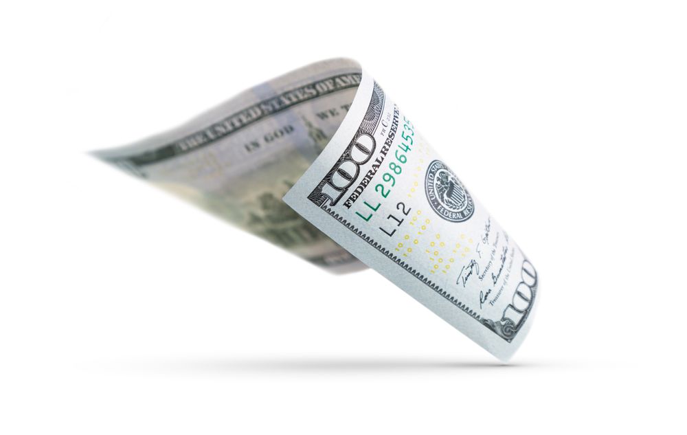 One Hundred Dollar Bill Floating Down To Surface with Drop Shadow