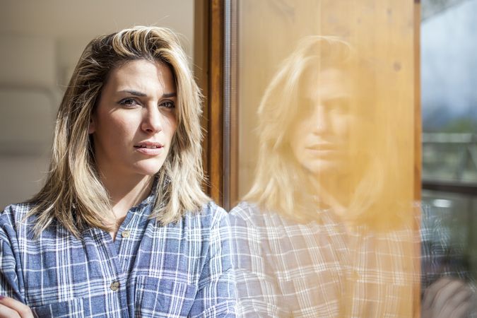Woman at home looking at camera