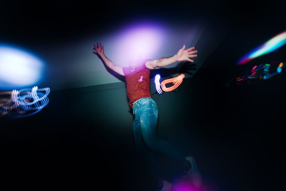 Man performing dance in spotlights