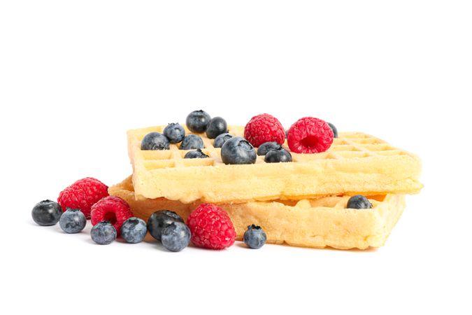Belgian waffles with berries isolated on blank background
