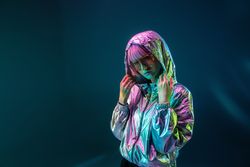 Woman standing in sparkly silver jacket