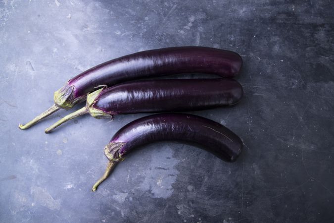 Fresh eggplant on a concrete Floor