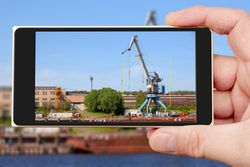 Person taking photo of crane