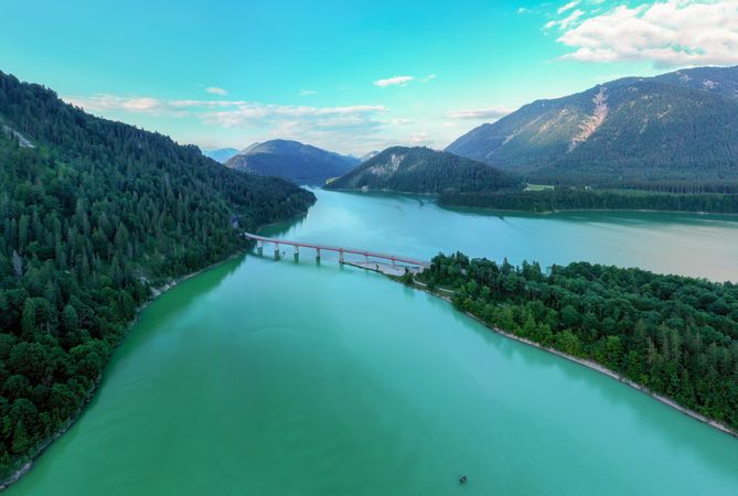 Drone aerial view of the Sylvenstein Lake at sunset, surrounded by Bavarian Alps, in Germany