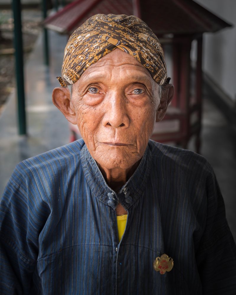 Java Island, Indonesia - August, 14 2015: Older Indonesian person looking at camera